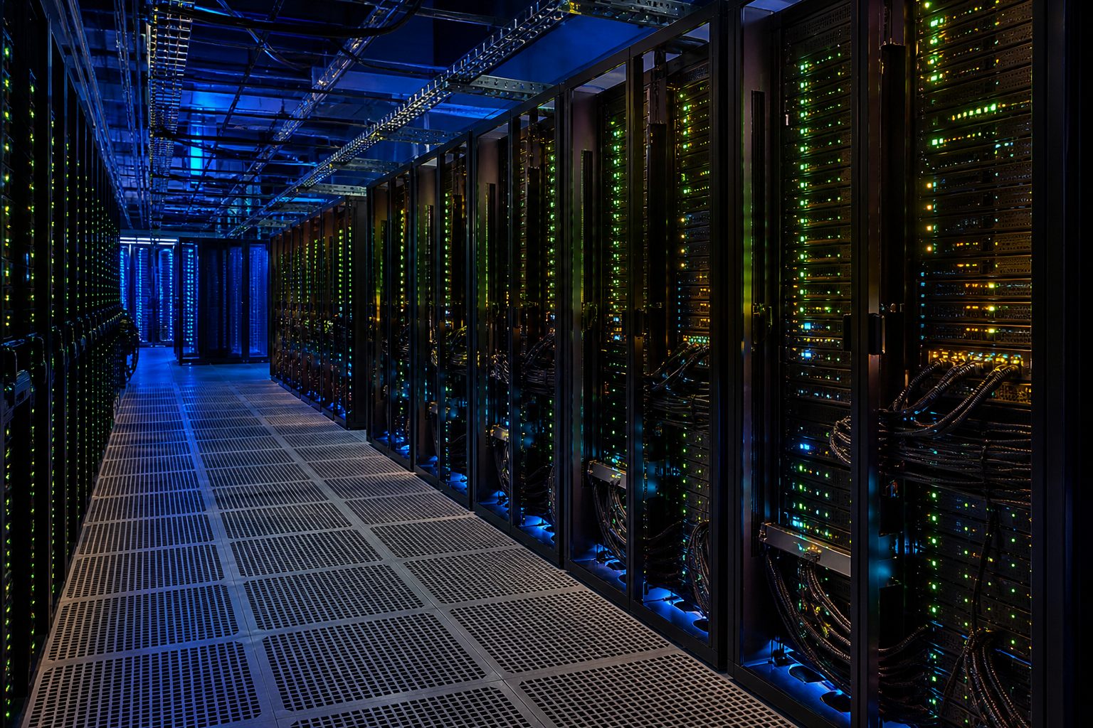 Server room with rows of blinking machines.